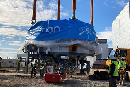 A large cyclotron is hoisted and lowered into place at the future home of the Lancaster General Hospital proton therapy center.